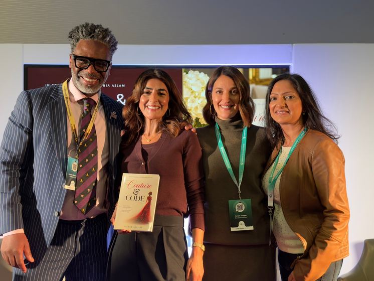 Sonia Aslam with guests holding a copy of Couture & Code
