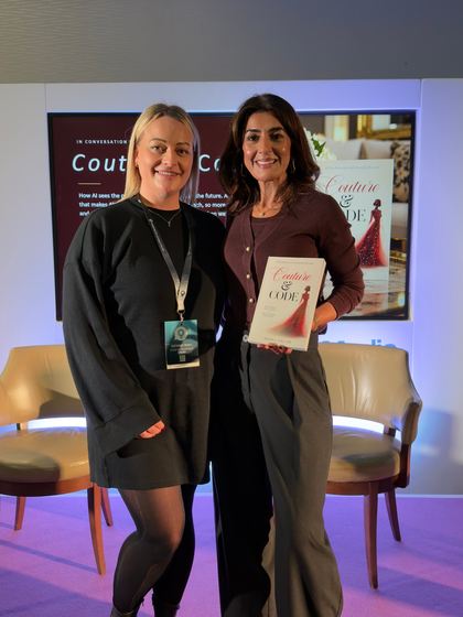 Sonia Aslam with a reader holding a copy of Couture & Code